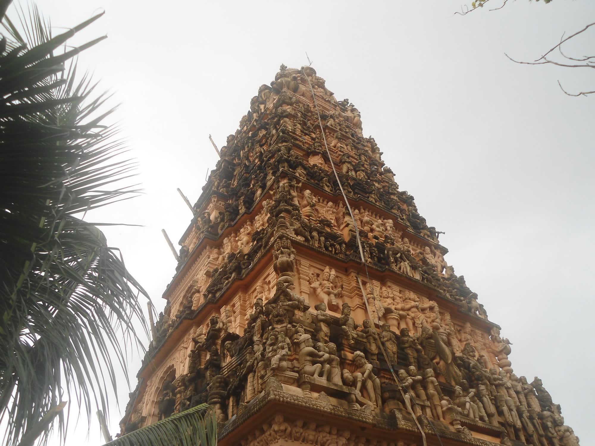The carved stone gateway tower of the temple against the morning sky